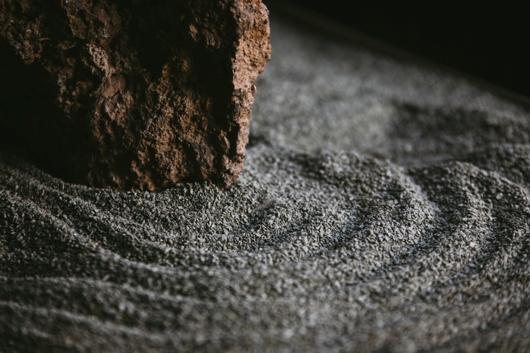 Peaceful Zen garden in Hotel Medellin Nido Sky, designed with stones, sand and carefully arranged plants